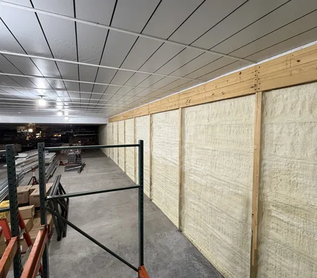 Spray foam insulated walls inside a large new commercial building under construction