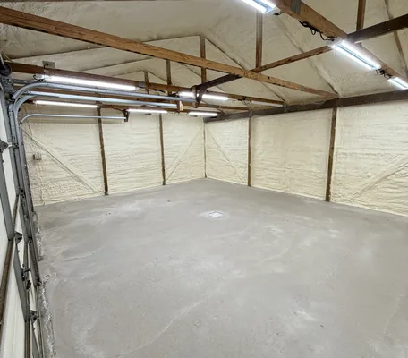 Steel wall and roof panels sealed with closed-cell spray foam in a central Pennsylvania metal building