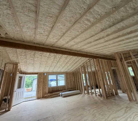 Spray foam insulation applied across the ceiling of a home under construction by Central PA Spray Foam